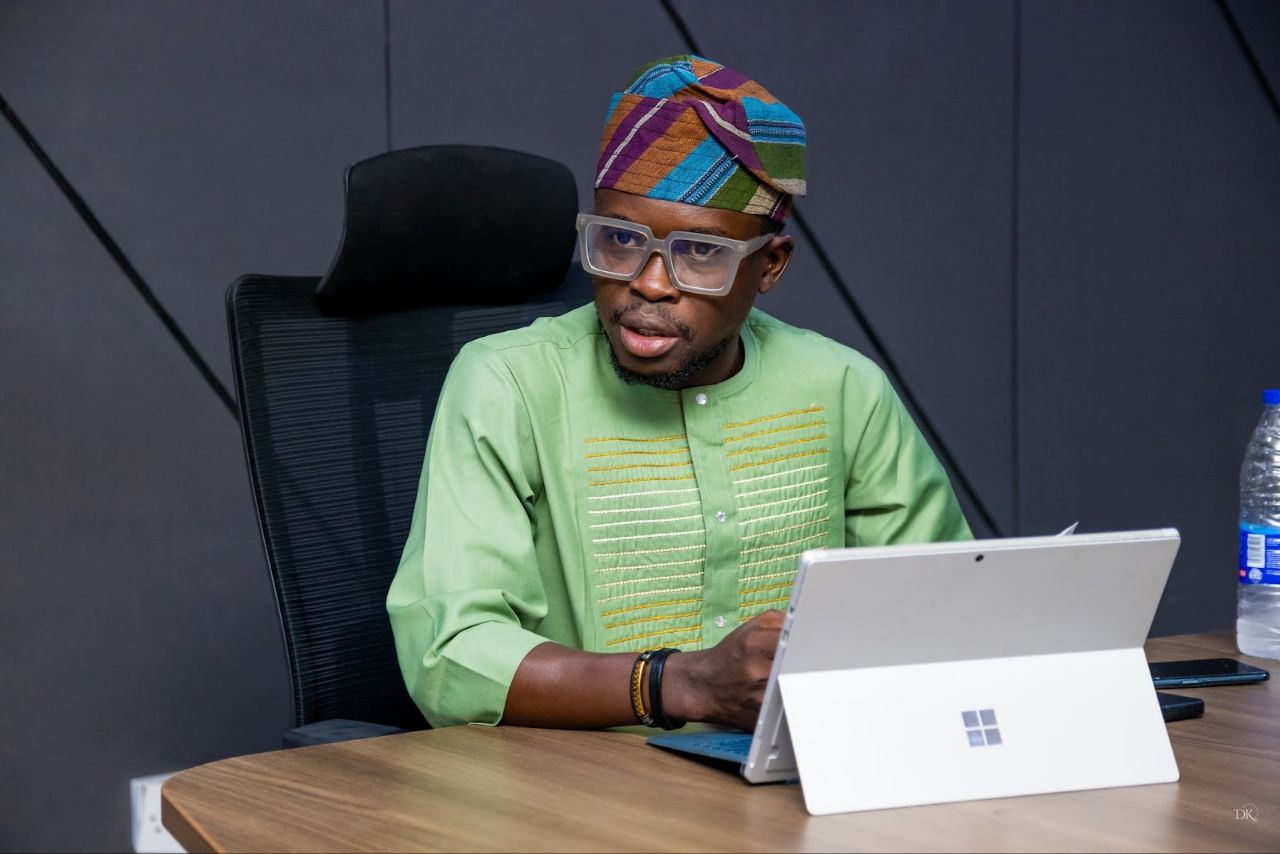 Mr. Alabi Opeyemi Oladimeji in an Oban Wears green kaftan and matching traditional cap